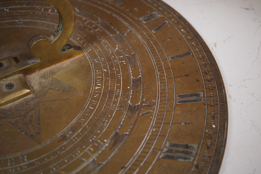 An early Victorian Adie & Son bronze sun dial, engraved; Edinburgh 1842, 32cm diameter, 19cm to end of gnomon. Condition - fair to good.